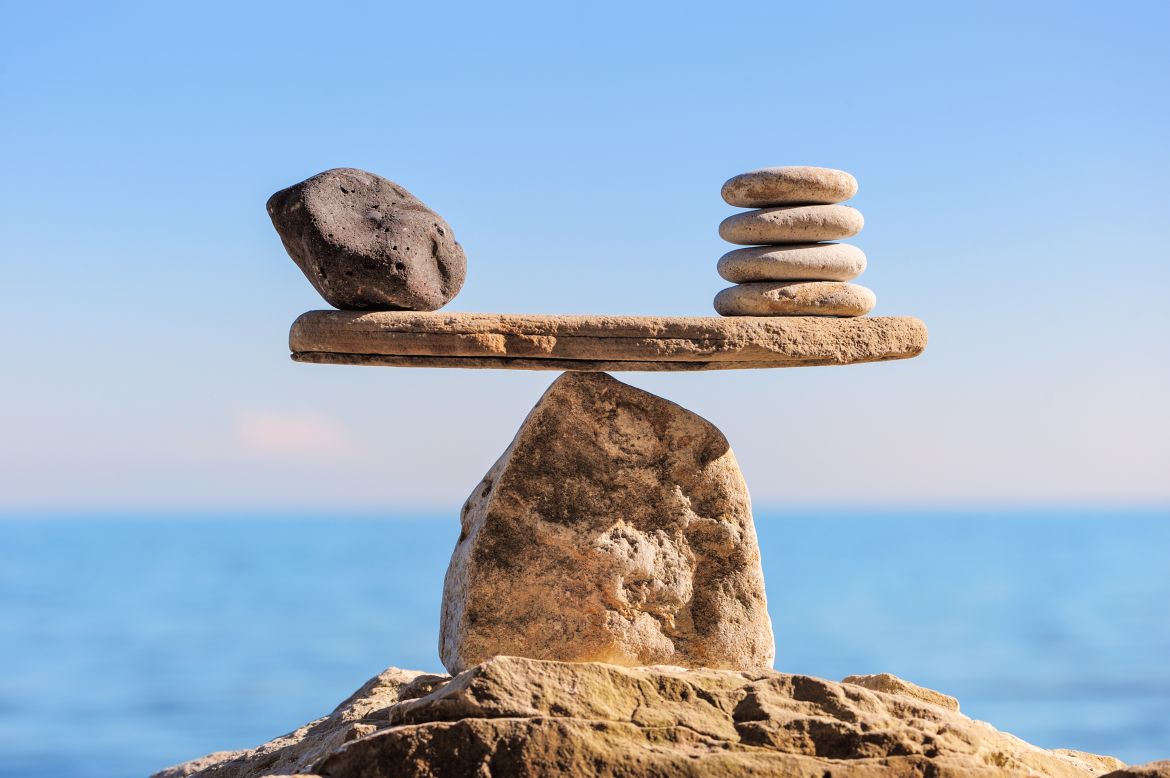 Stones balancing on sea sand
